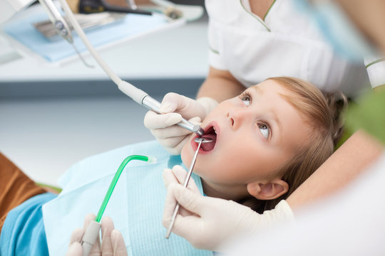 Experienced female dental doctor is treating patient