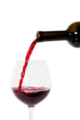 Red wine pouring into wine glass
