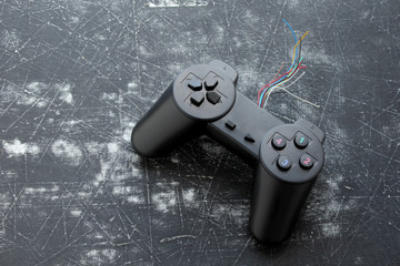 Old joystick on grunge background