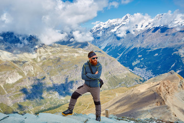 hiker at the top of a pass