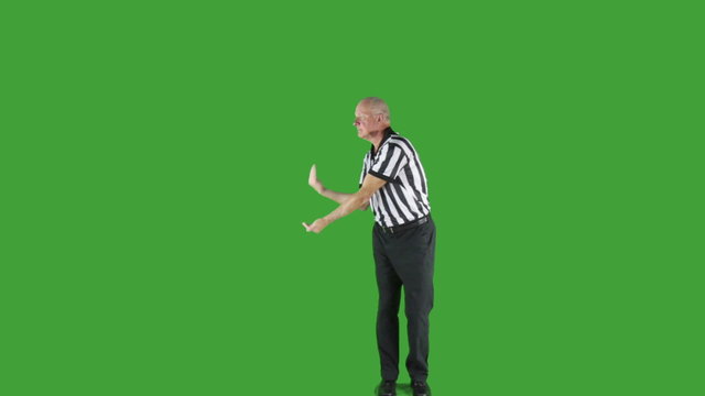 Man dressed in basketball referee uniform signaling Time In.