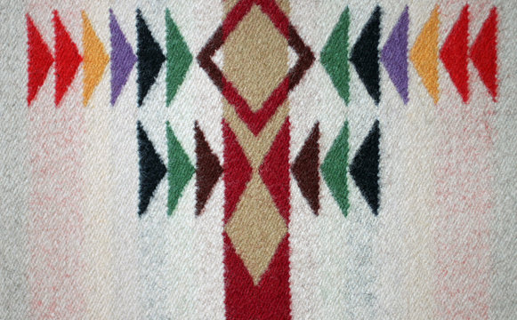 Symmetrical Multicolored Design on a Woven Woolen Blanket