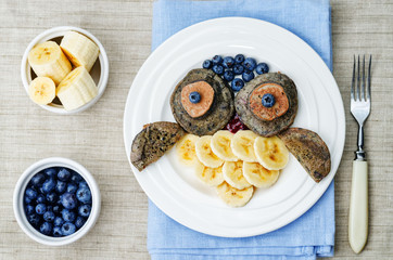 blueberry chocolate pancake with bananas in the shape of an owl