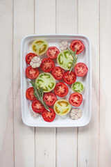 Halves of various tamatoes on the platter