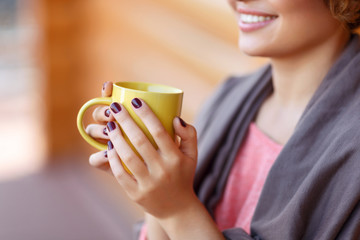 Delighted girl drinking tea 