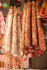 Catalan dry sausages called fuet at Mercat de Sant Josep de la Boqueria market in Barcelona