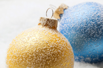 Christmas balls on snow