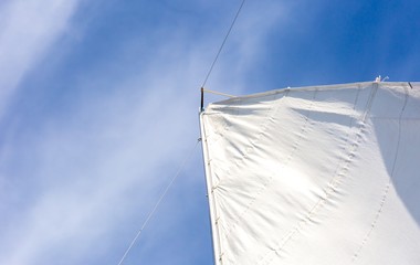 Fototapeta premium Close up of yacht mast and sail