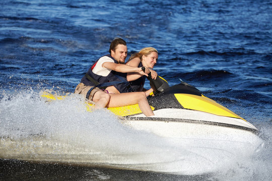 Couple Riding Jet Ski