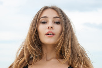 Fototapeta premium Closeup portrait of beautiful emotional girl outdoor