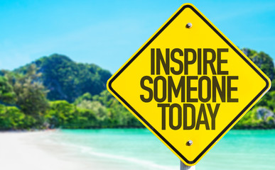 Inspire Someone Today sign with beach background
