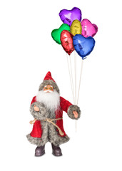 Santa Claus doll with some colored balloons for birthday around christmas time.