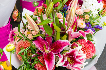 Bouquet of blooming flowers with dahlias and lilies