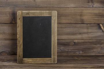 Antique chalkboard on wooden texture. Rustic background