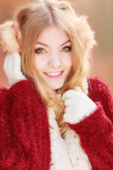 Portrait of pretty smiling woman in earmuffs.