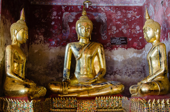 Gild Buddha Sculpture at Ancient Veranda of Wat Suthat, Bangkok of Thailand.