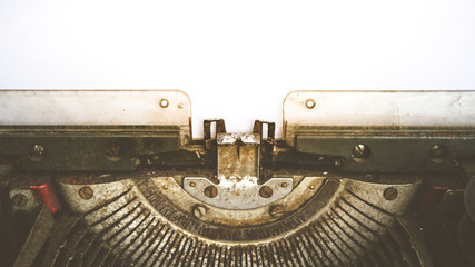 Typewriter and empty white paper , vintage style