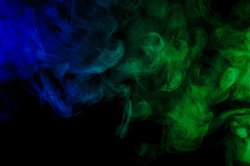 Obraz premium Abstract blue and green smoke hookah on a black background.