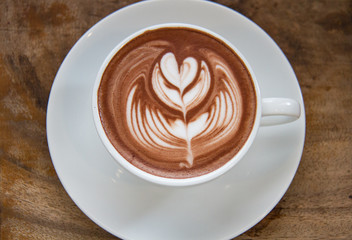 Hot Chocolate art on the wooden table.