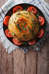 French timbale of pasta with cheese and vegetables. vertical top view
