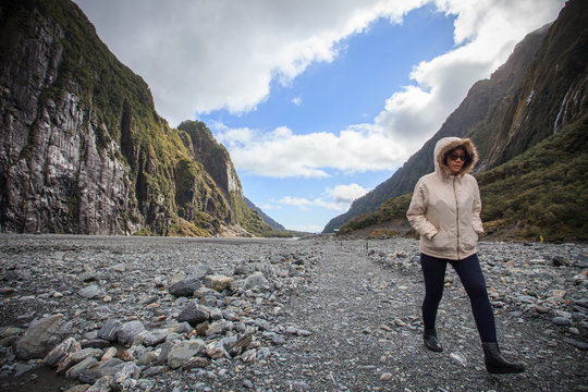 woman traveler walking in fox glacier trail important traveling