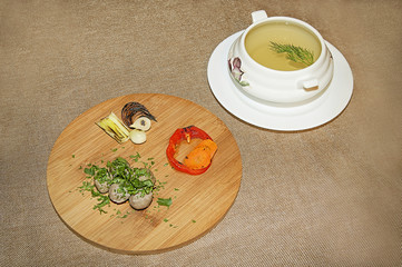Delicious dinner with soup and meat