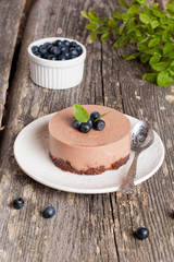 Mini-cheesecake and chocolate biscuits and blueberries