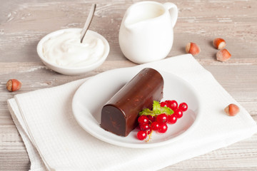 glazed cheese curds with chocolate and fresh currant . sweet bre