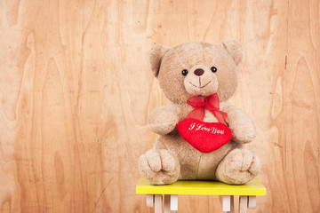 taddy bear on wooden background