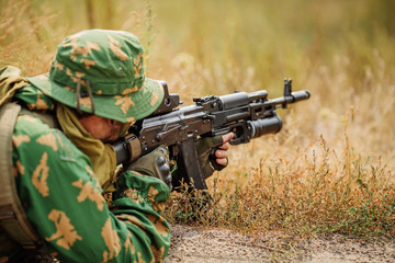Fototapeta premium russian soldier in the battlefield with a rifle