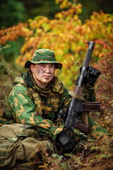 Fototapeta premium russian soldier in the battlefield with a rifle