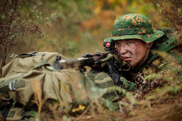 russian soldier in the battlefield with a rifle