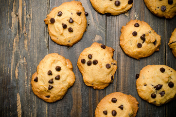 Homemade chocolate chip cookies on wooden background