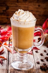 pumpkin latte with whipped cream in a glass jar