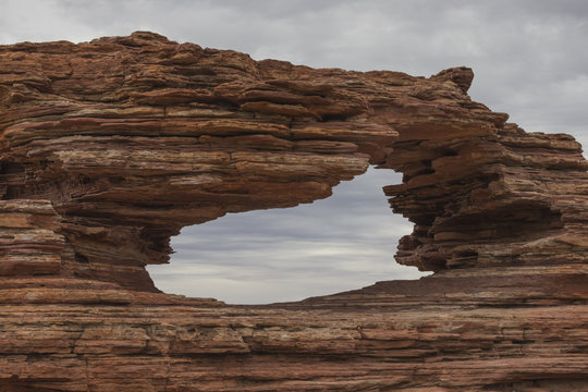 Fototapeta ERODED ROCK FORMATION NATURE'S WINDOW TO THE SKY