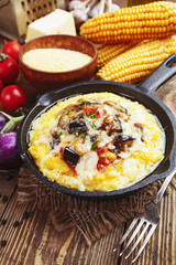 Polenta baked with vegetables and cheese