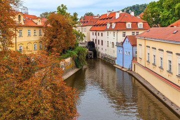 Fototapeta na wymiar Narrow canal and colorful houses in Prague.