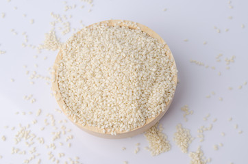 sesame seeds with wooden spoon