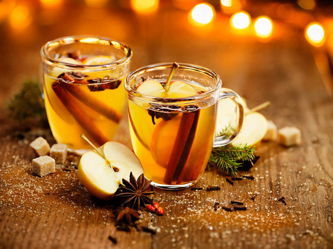 Fototapeta Hot cider with spicy seasonings and citrus fruits