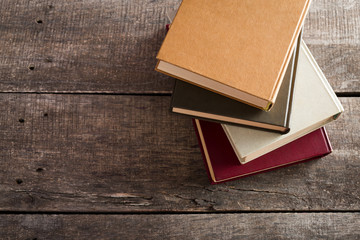 Retro books on wooden background