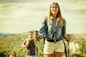 group of hikers in the mountain in single file