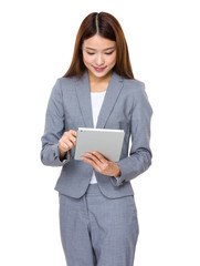 Asian young businesswoman use of the tablet pc