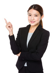 Young businesswoman with finger point up