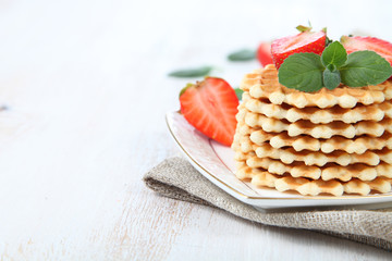 Waffles and ripe strawberries.