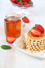 Waffles and ripe strawberries.