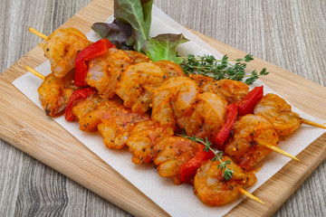 Raw tiger shrimps skewer