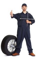 Car mechanic with a tire wrench.