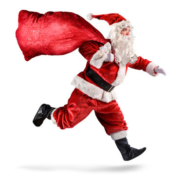 Santa Claus Running With A bag Of Gifts On A White Background
