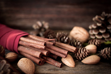 Christmas mood. cinnamon, walnuts and pine cone