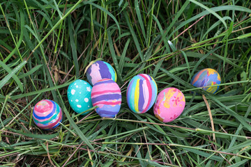 Fototapeta na wymiar Easter eggs in Green Grass. Selective focus.